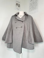 Grey poncho coat with elegant buttons