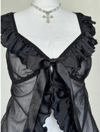 Black top with a bow an ruffles