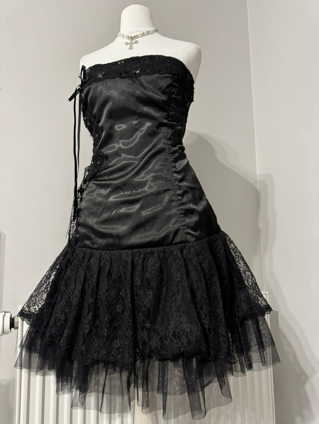 Black dark coquette mini dress with a flower detail