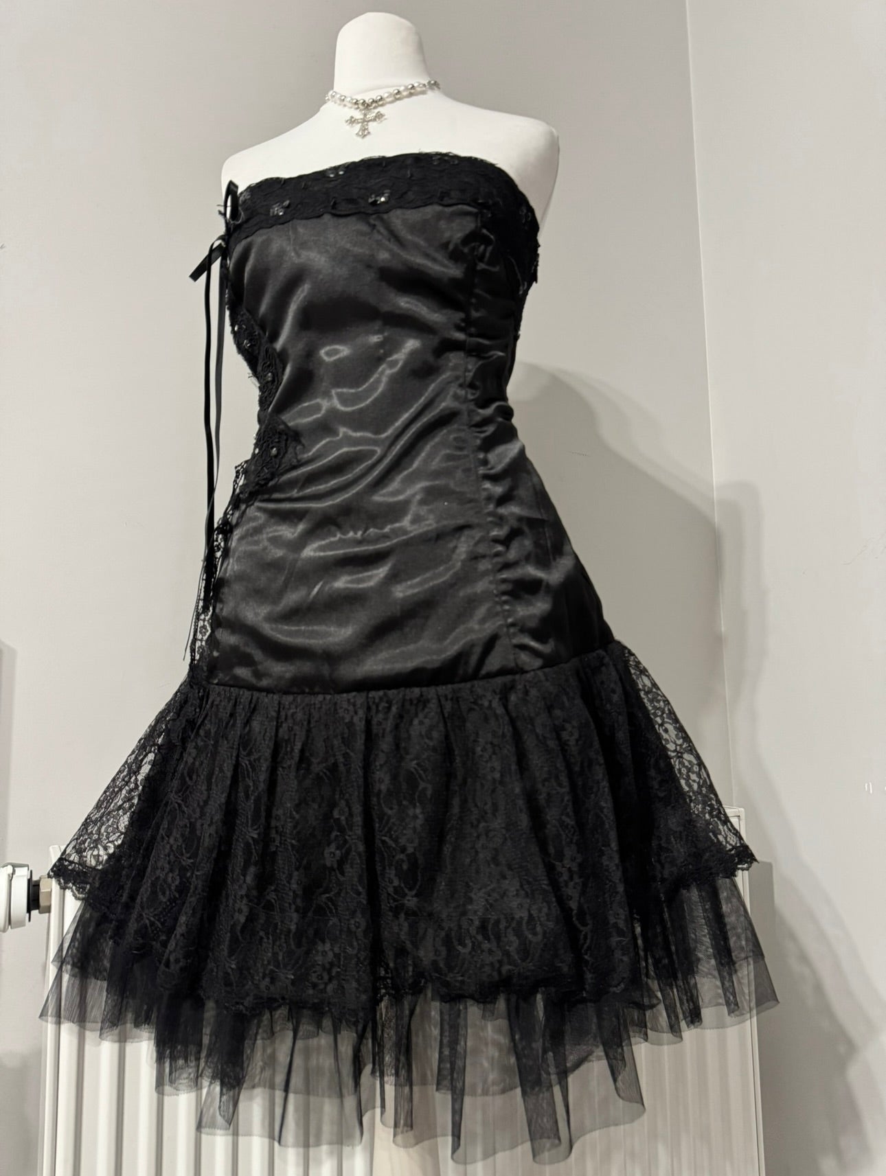 Black dark coquette mini dress with a flower detail