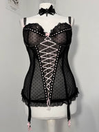Black polka dot lace-up corset with a little bow