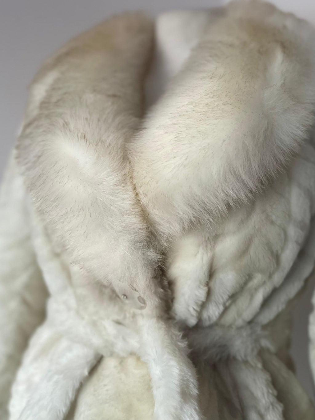 Faux fur coat with belt
