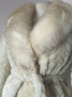 Faux fur coat with belt