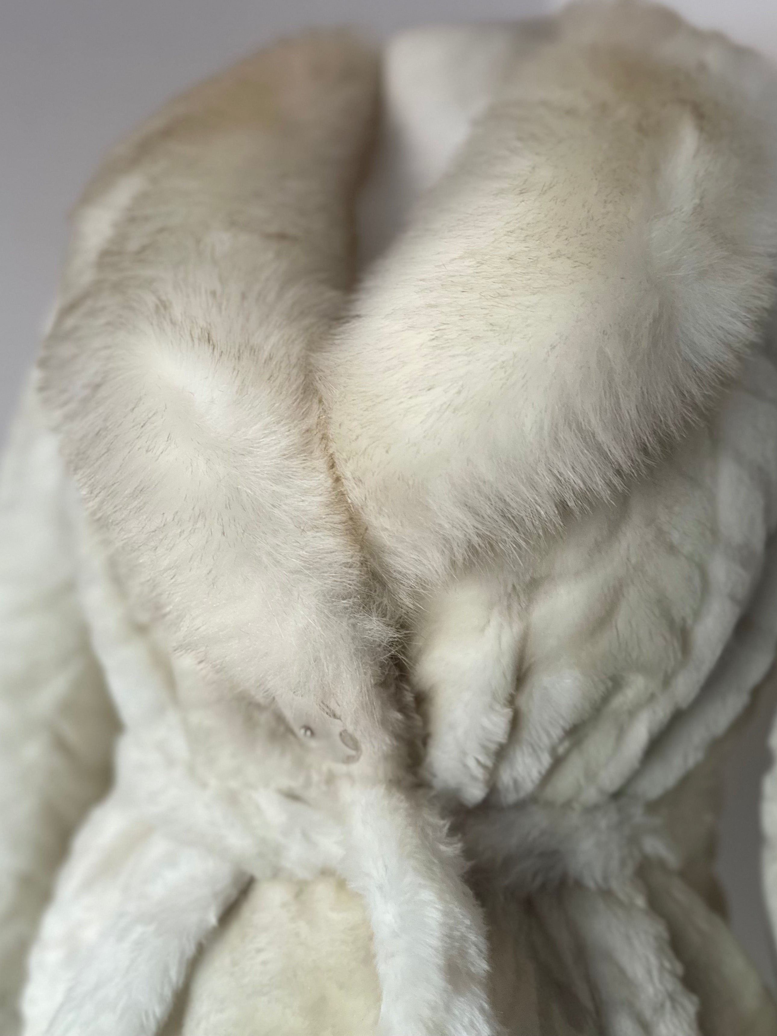 Faux fur coat with belt