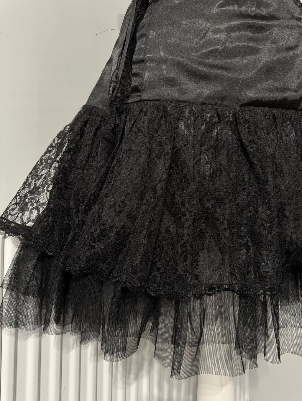 Black dark coquette mini dress with a flower detail