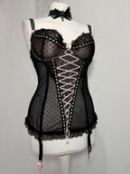 Black polka dot lace-up corset with a little bow