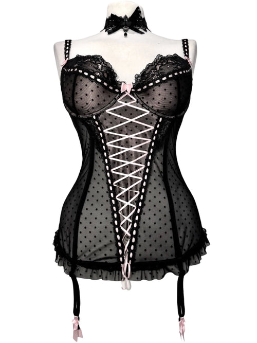 Black polka dot lace-up corset with a little bow