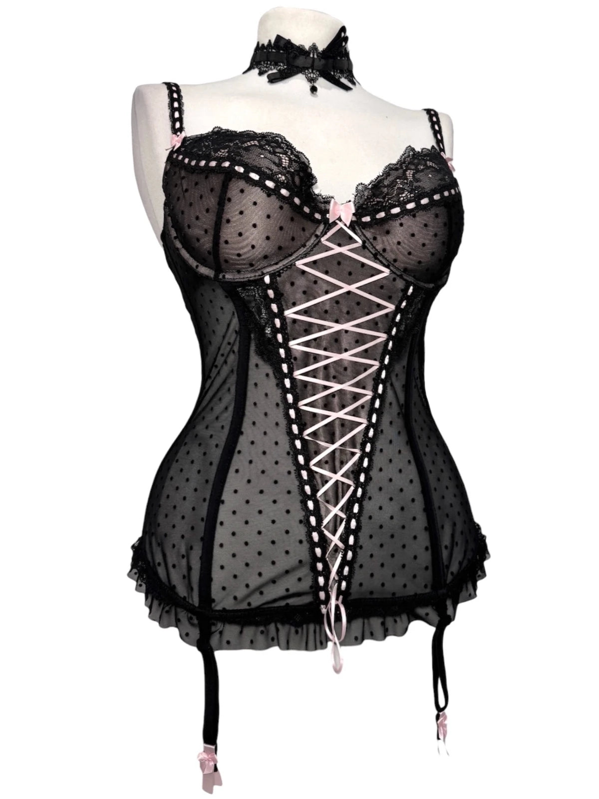 Black polka dot lace-up corset with a little bow