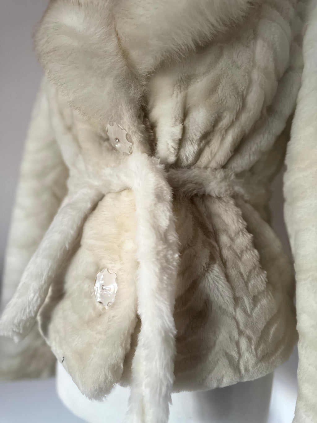 Faux fur coat with belt