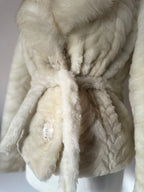 Faux fur coat with belt