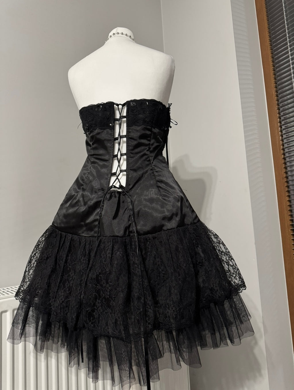 Black dark coquette mini dress with a flower detail