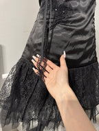 Black dark coquette mini dress with a flower detail